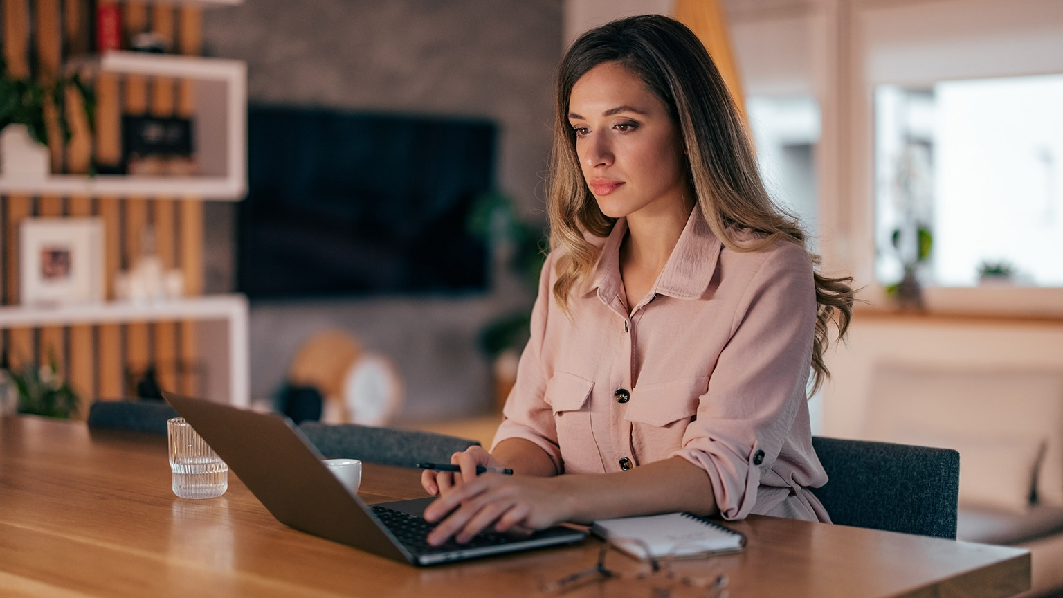 A person reading information on a laptop