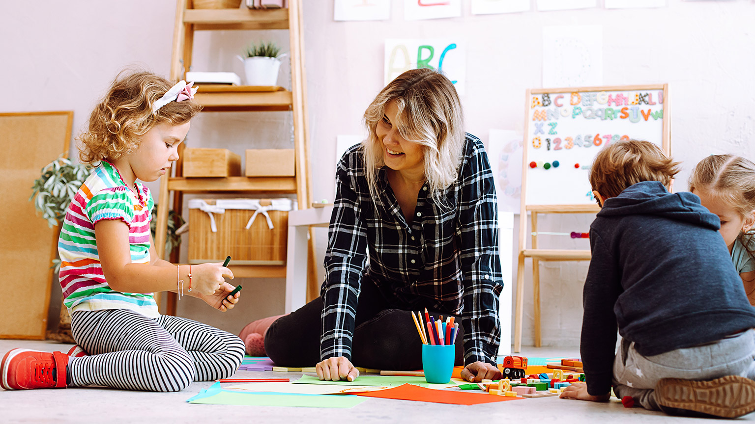 A teacher interacting with young children