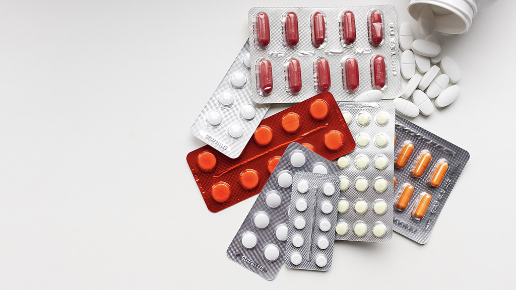 Pharmacological preparations and pills on a white background