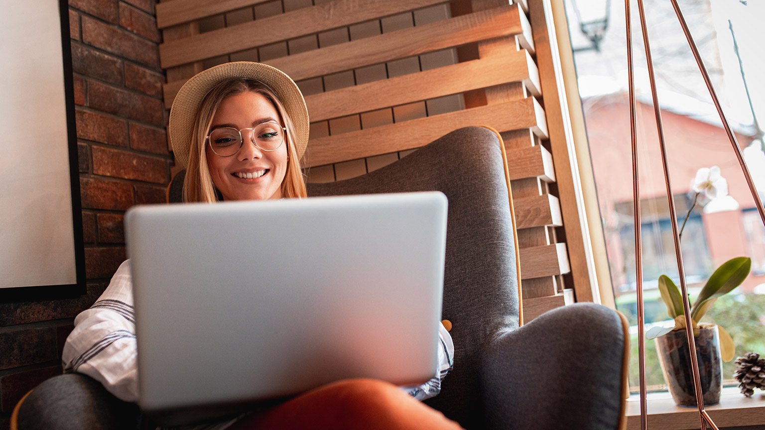 A person reading information on a laptop