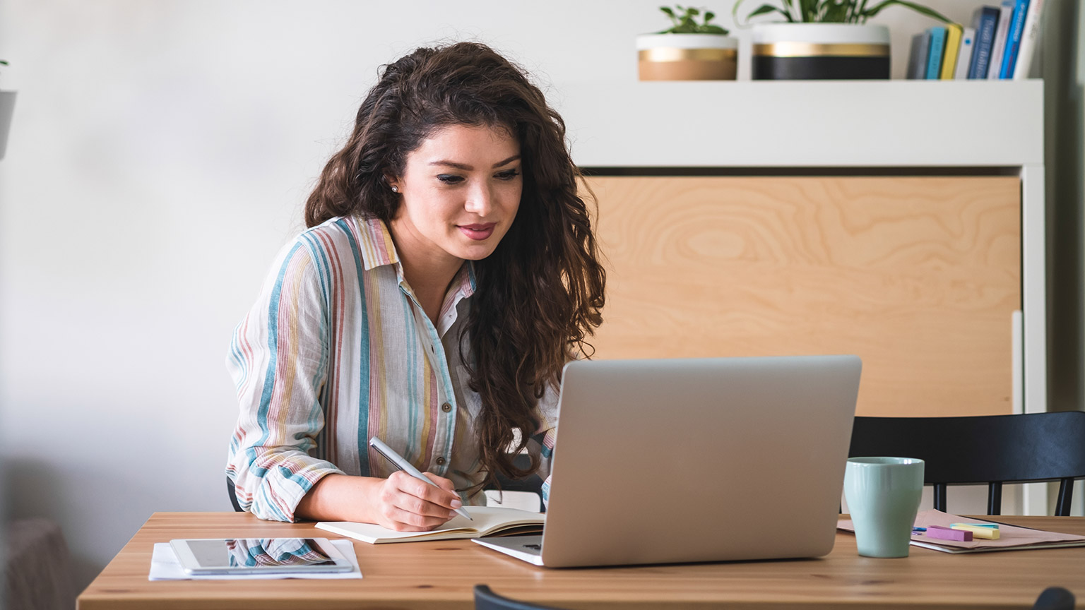 A person reading information on a laptop