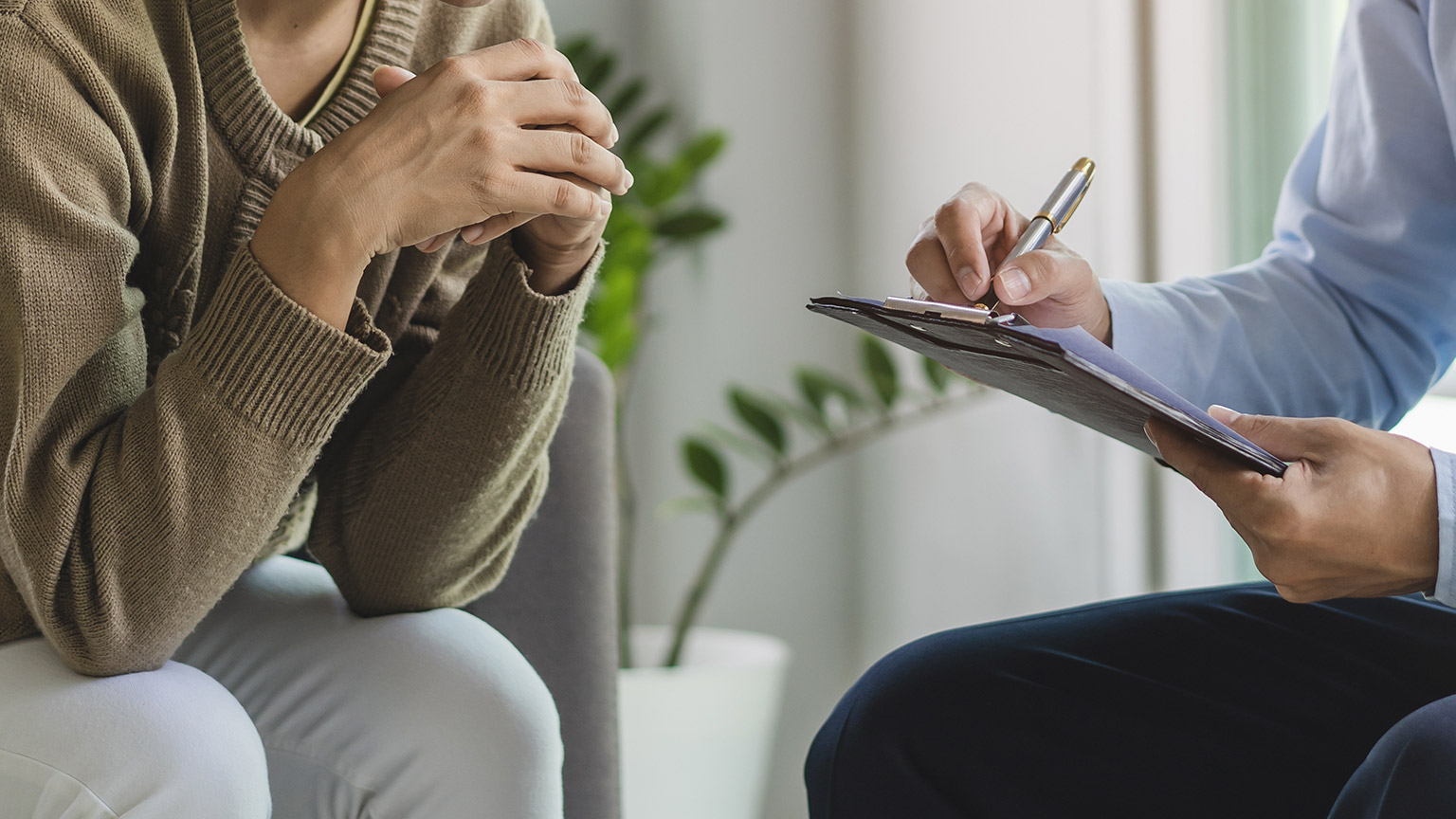 mental health treatment concept. Stressed asian patient talking with personal psychologist in therapist session have a burnout in work at clinic in office