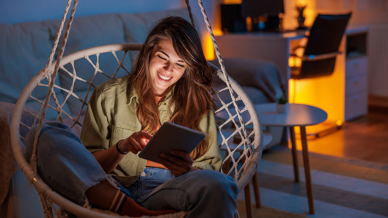 A person reading informaiton from a tablet device