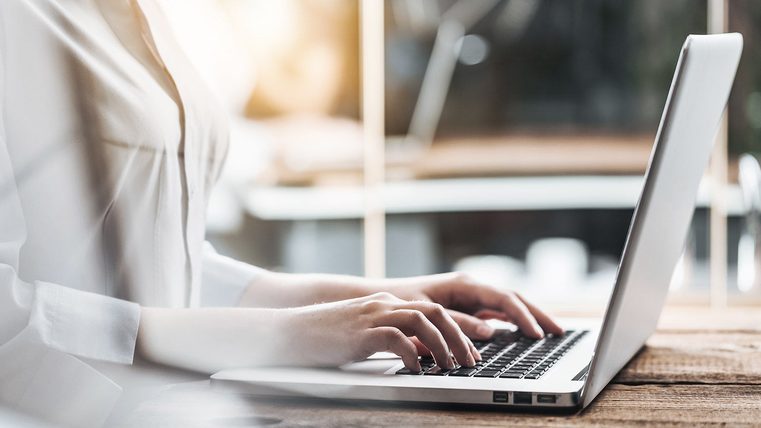 Woman typing on computer