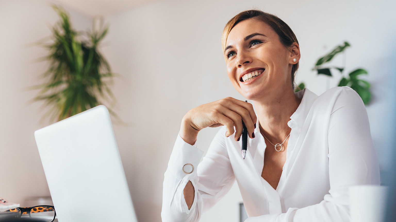 A smiling professional in a modern office