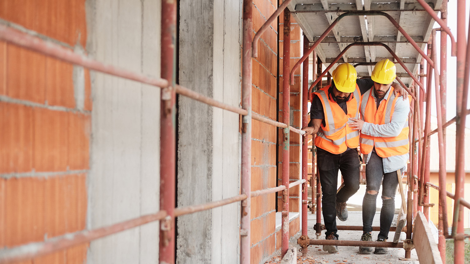 A worker helping a colleague