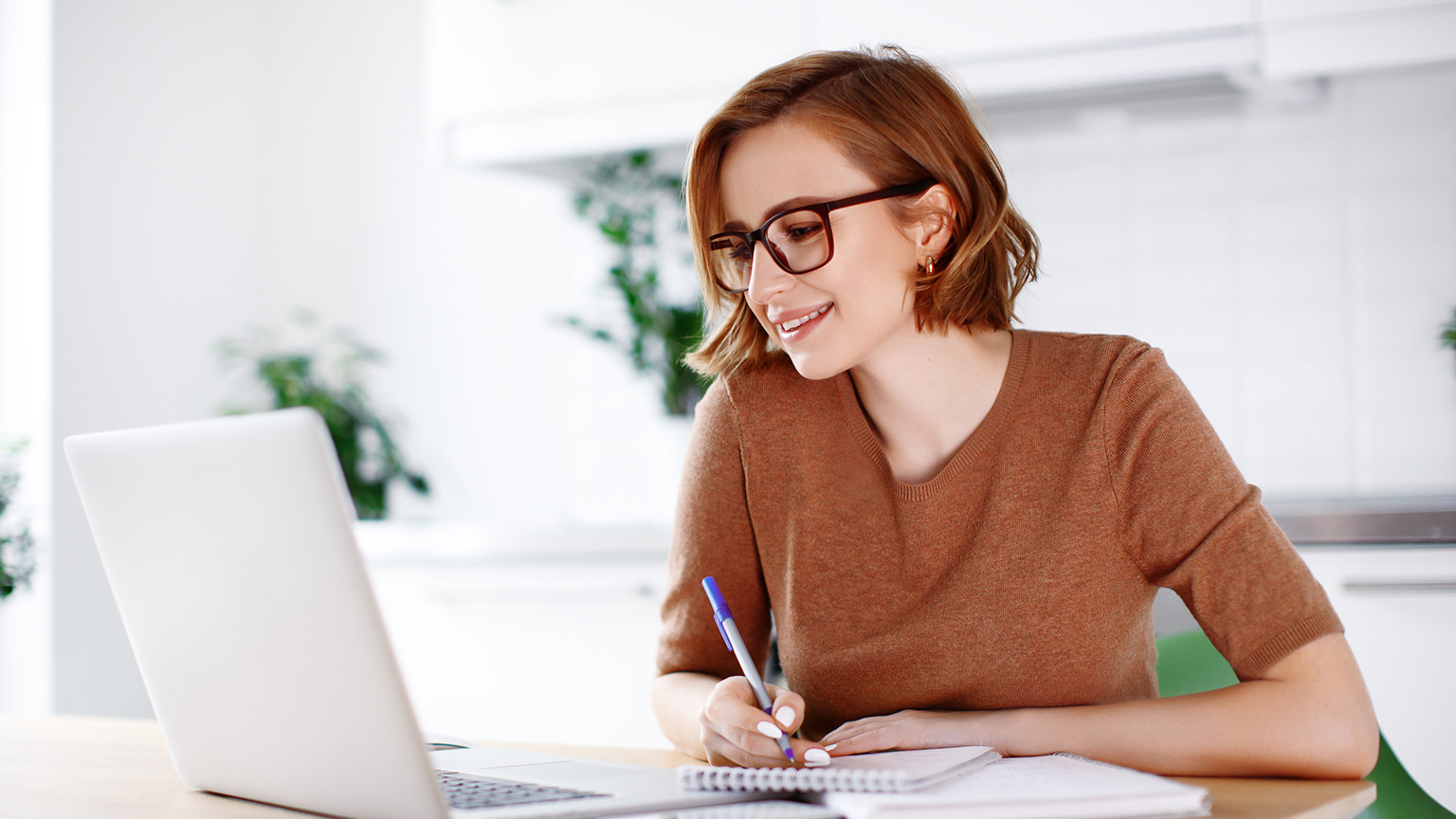 A person studying information on a laptop