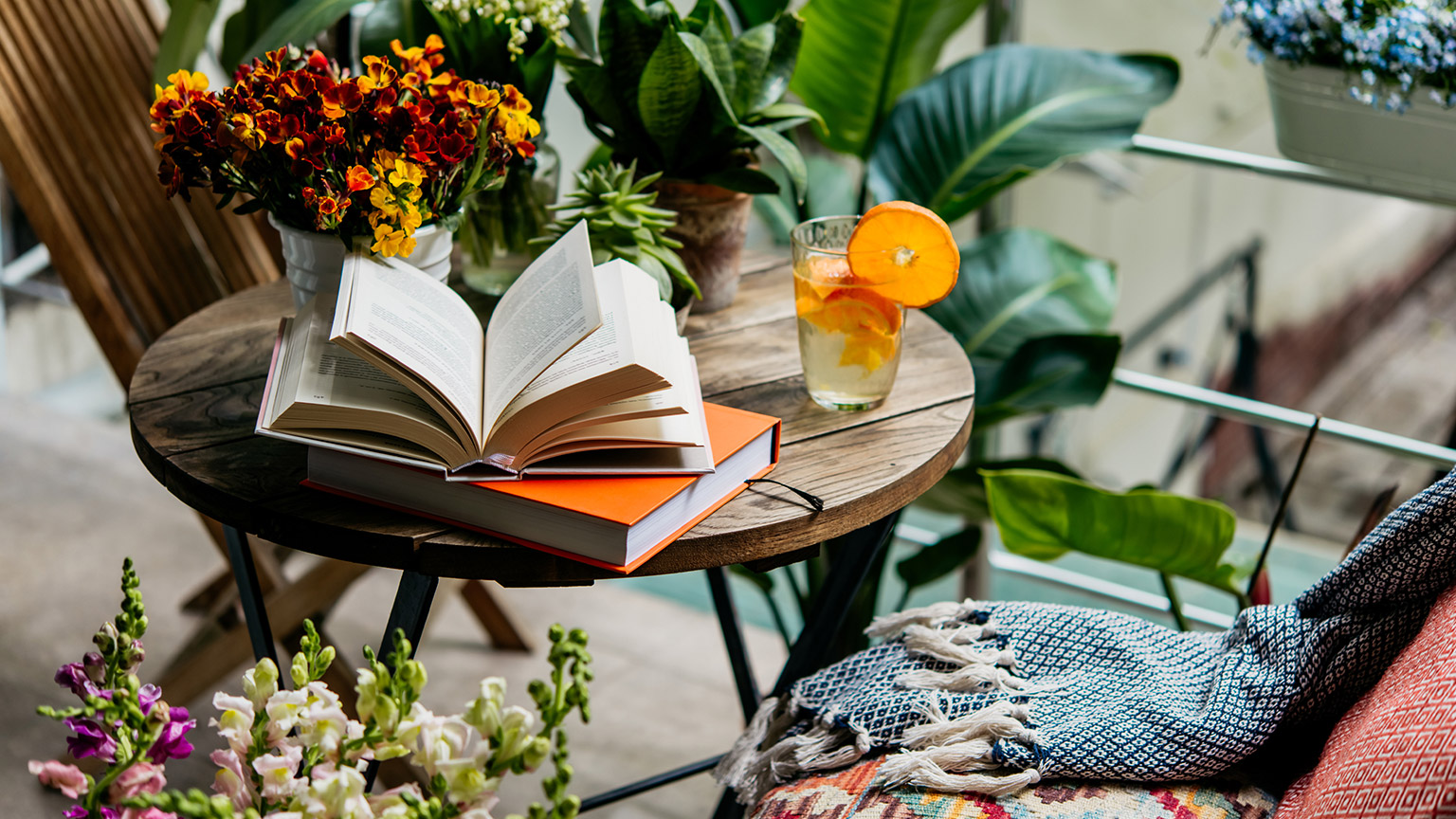 A book on a table in a garden