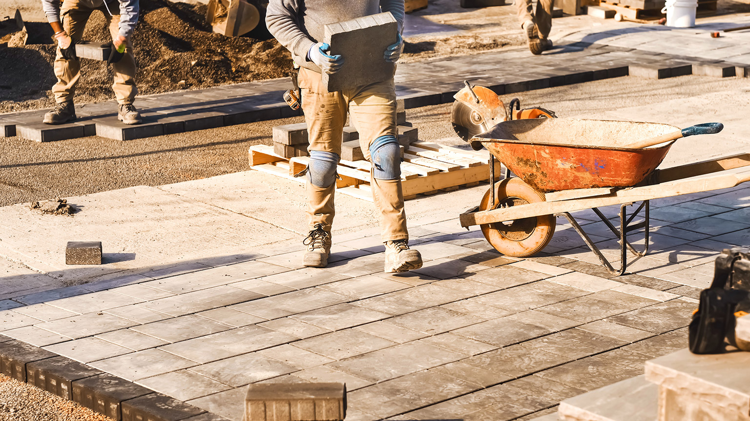 People doing landscaping work on a construction site