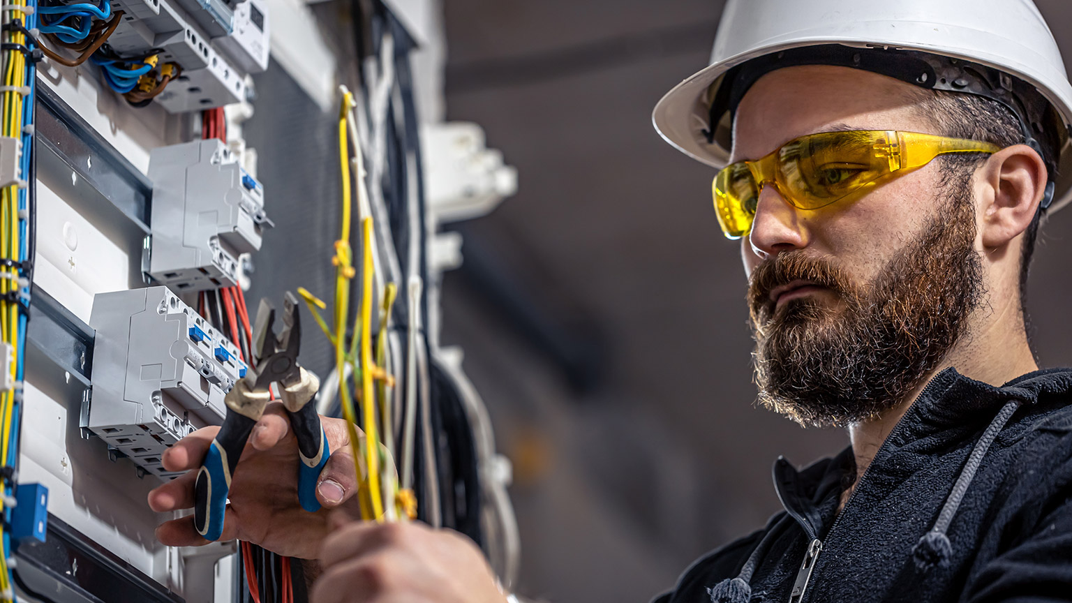 An electrician doing electrical work