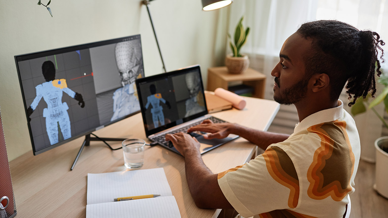 A designer working on a desktop computer