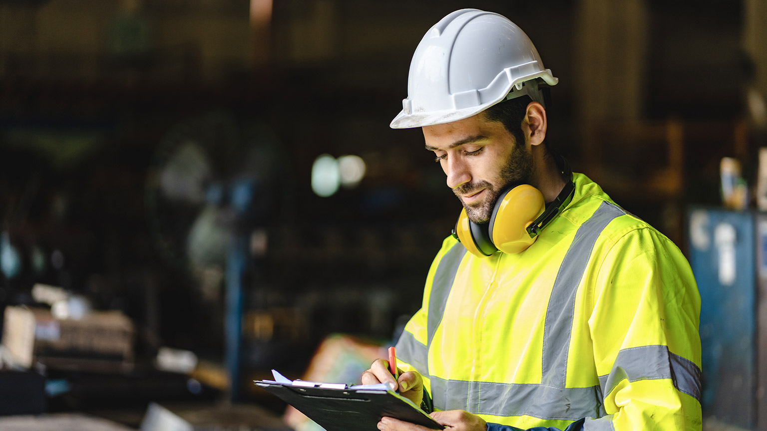 professional technician engineer with safety hard hat working to maintenance construction 