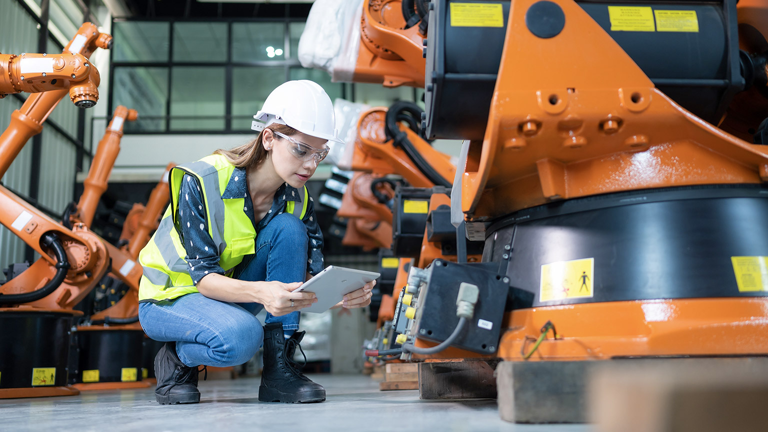 Female Technician Inspecting and repairing.