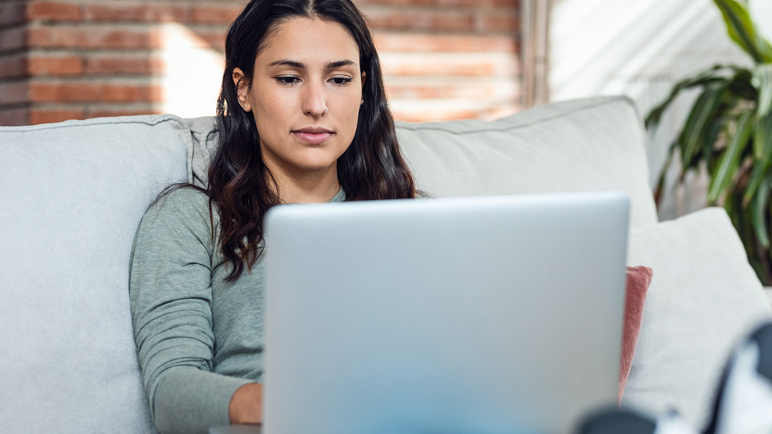 A person reading information on a laptop