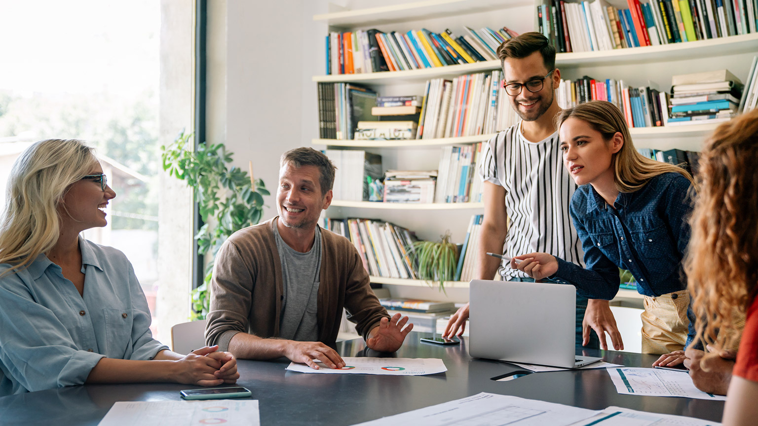 A business group discussing an issue in an office