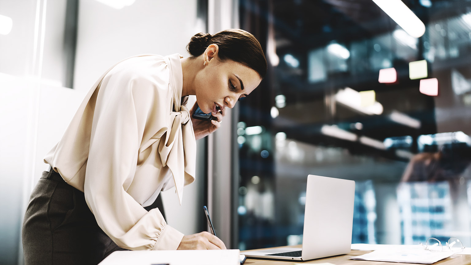 concentrated young female standing on her work station