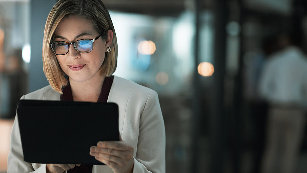 Business woman, tablet and typing in office for corporate communication