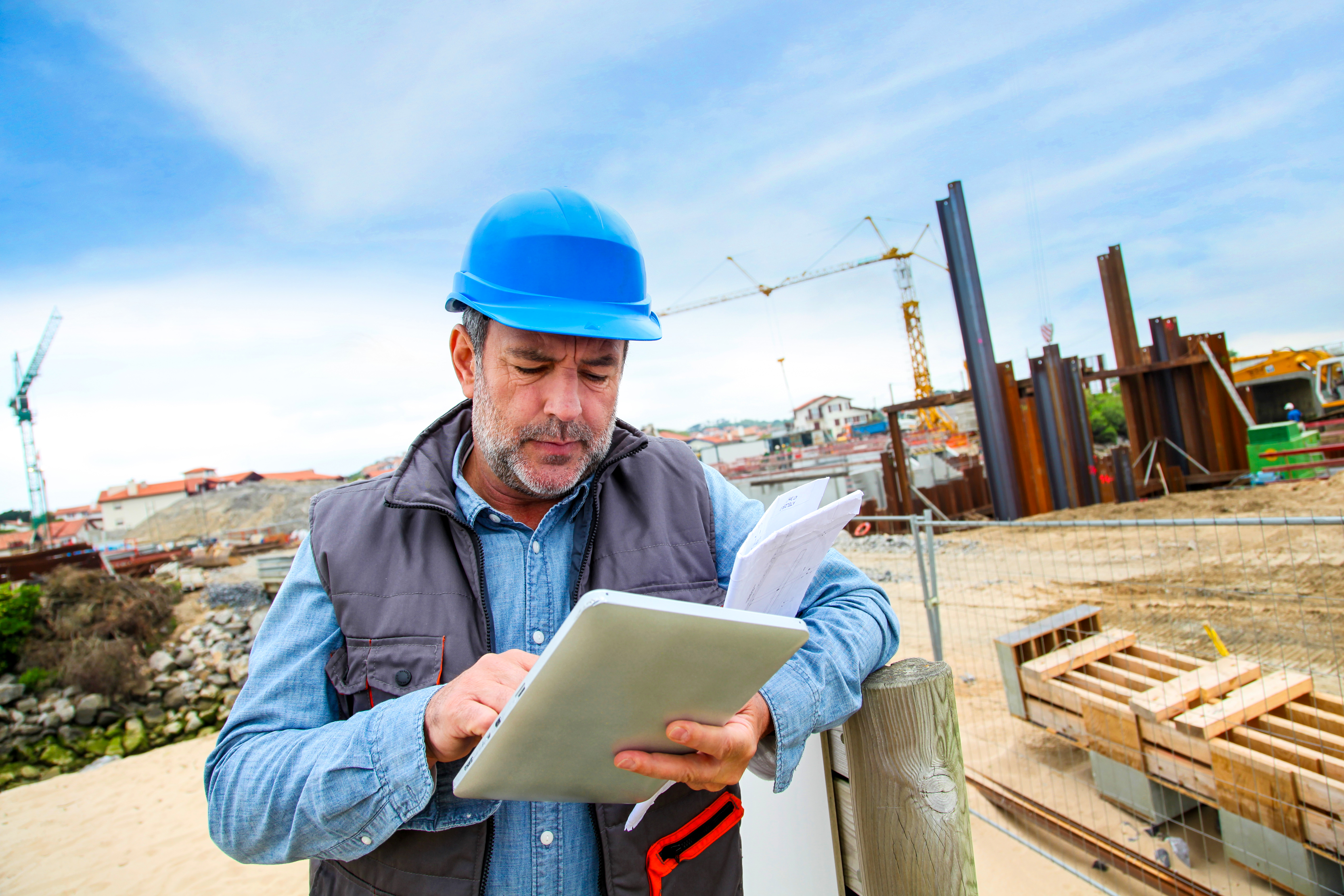 A person reading information on a work site