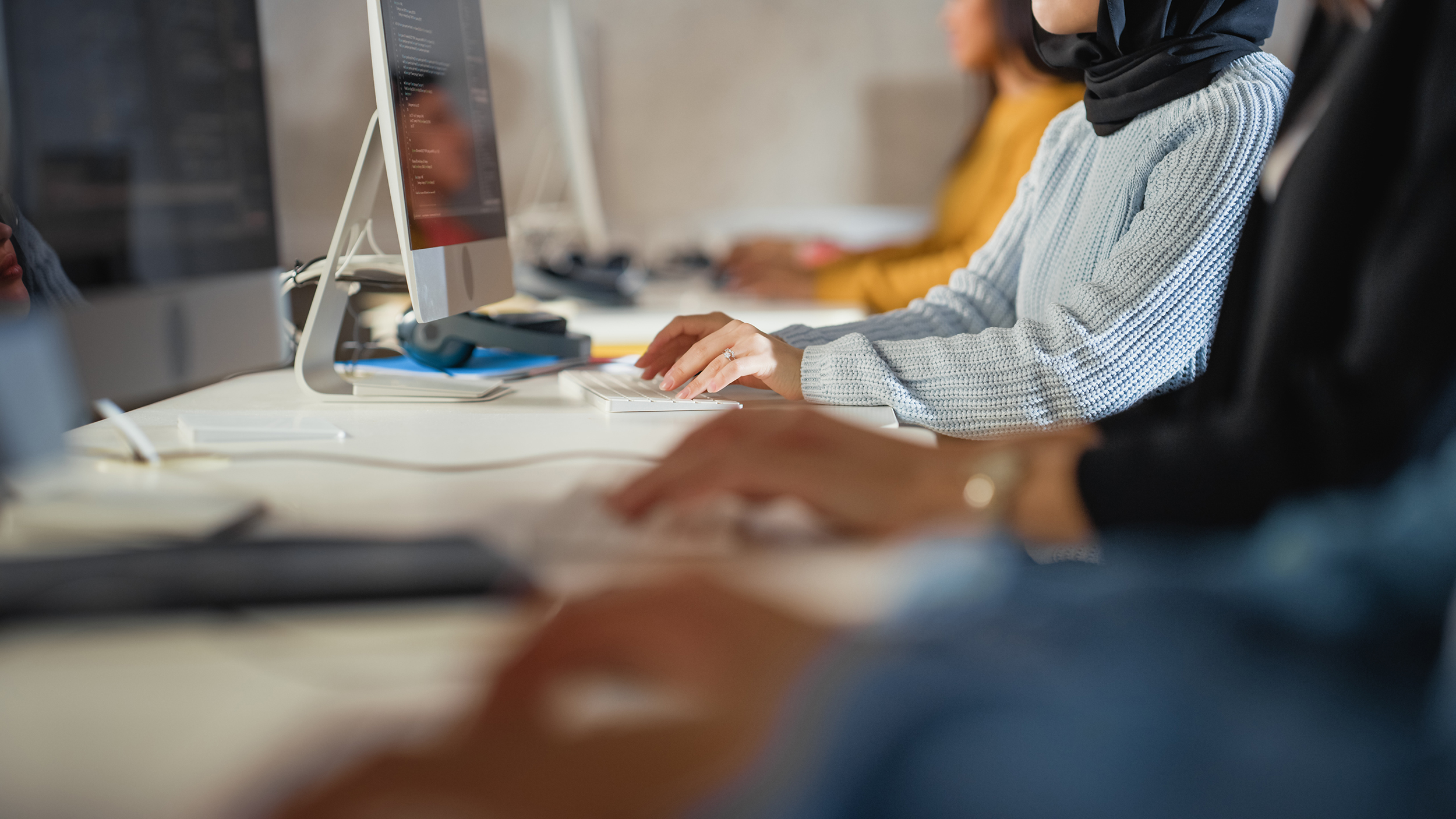 People reading information on computers