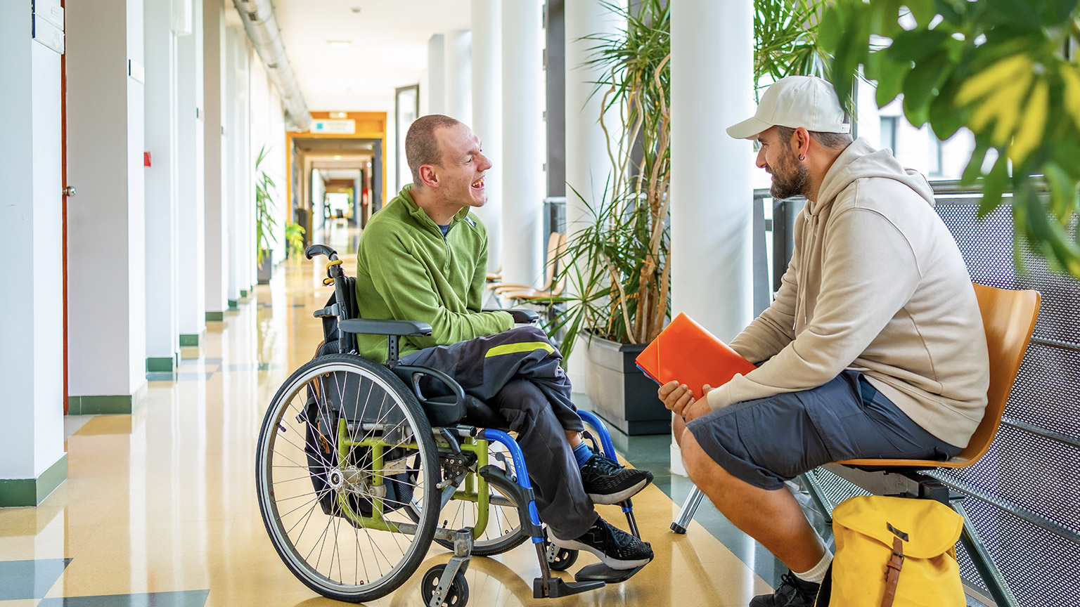 A carer and client talking