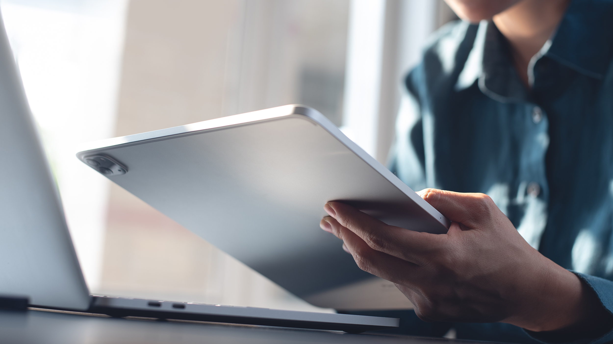 A person reading information on a laptop