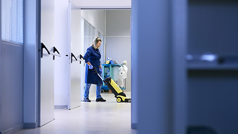 A cleaner working in an office