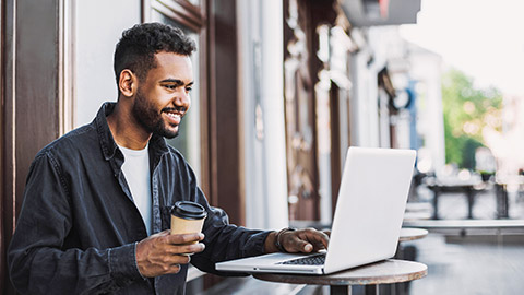 A person studying online at a cafe