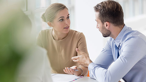 colleagues discussing during meeting in office