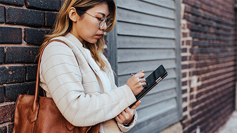 A consumer accessing a major retailer online, while out and about in the city