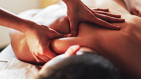 A close view of a person receiving a massage