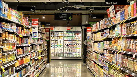 An empty, well-lit Woolworths aisle during their quiet hour