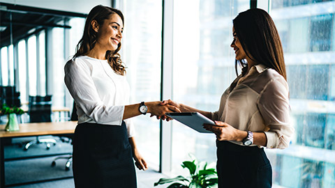 A Manager congratulating an employee on the new promotion thay've just accepted