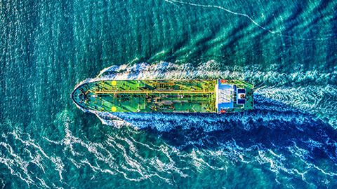 A freighter sailing out of the bay and into the open ocean