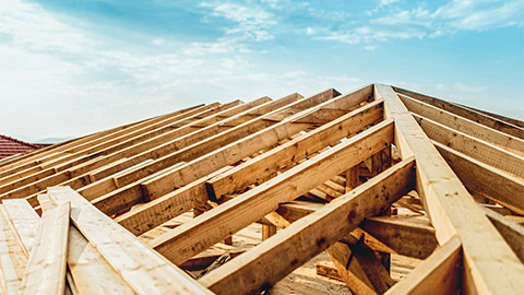 The timber frame of a residential house's roof