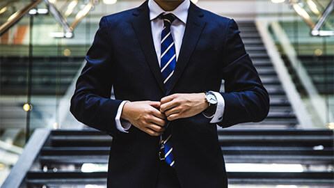 A close up of a banker's tie and blazer