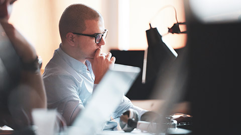 A person looking at a computer screen