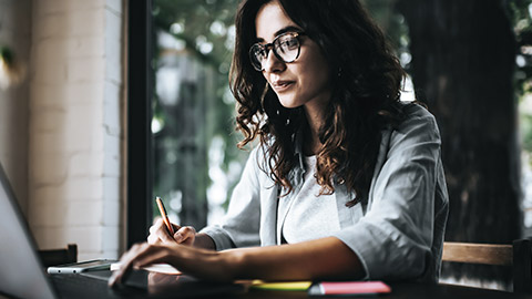 Woman taking notes