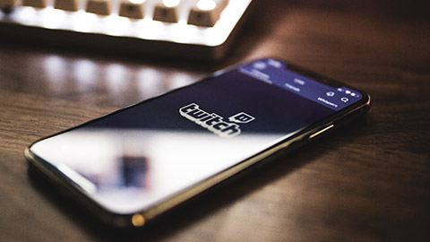 A close view of a mobile phone with Twitch on the screen