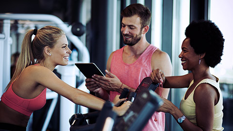 Group of people at gym talking happily