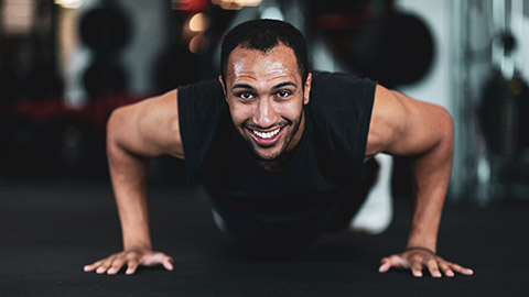 A person smiling while working out