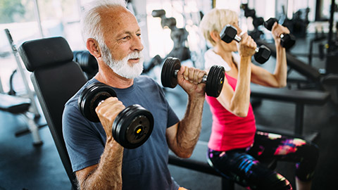 Elderly clients working out in a gym