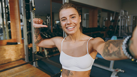 A smiling trainer taking a selfie