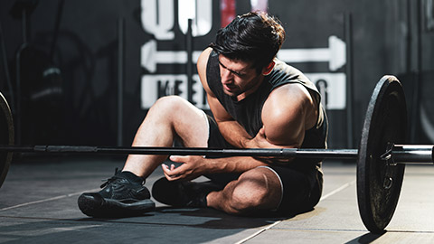 A young person that has injured their arm lifting weights