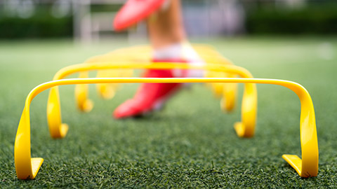 A close view of a person training with agility equipment