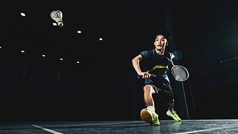 A badminton player on a court