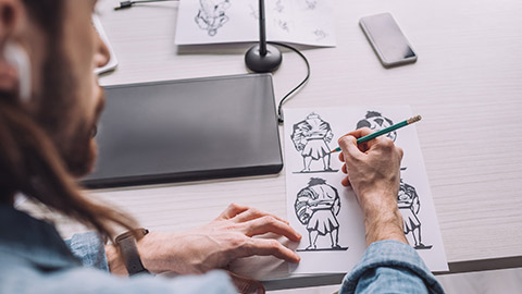 Over-the-shoulder shot of an illustrator at work