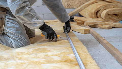 man applying thermal insulation