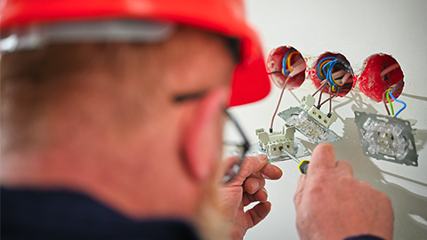 electrician fixing sockets and plugs