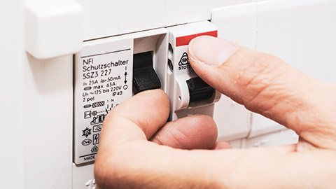 A close view of a person pressing an RCD