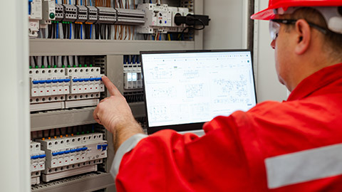 An electrician reading a diagram